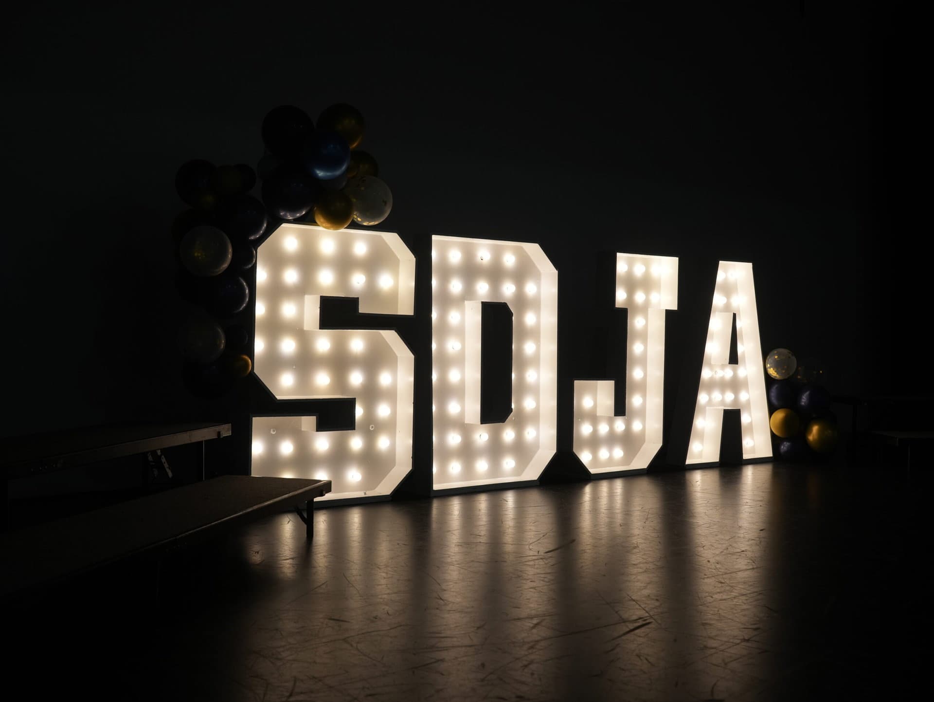 SDJA letters lit up with lights