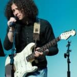 Upper Schooll student playing guitar.