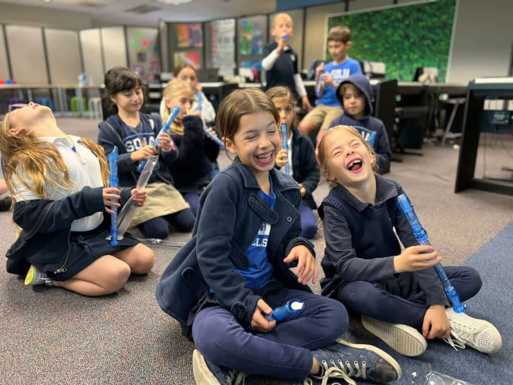 GMLS students laugh and play during music class