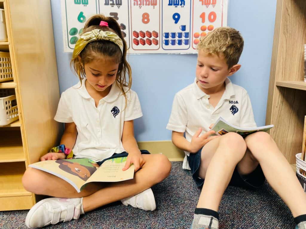Lower School students reading together