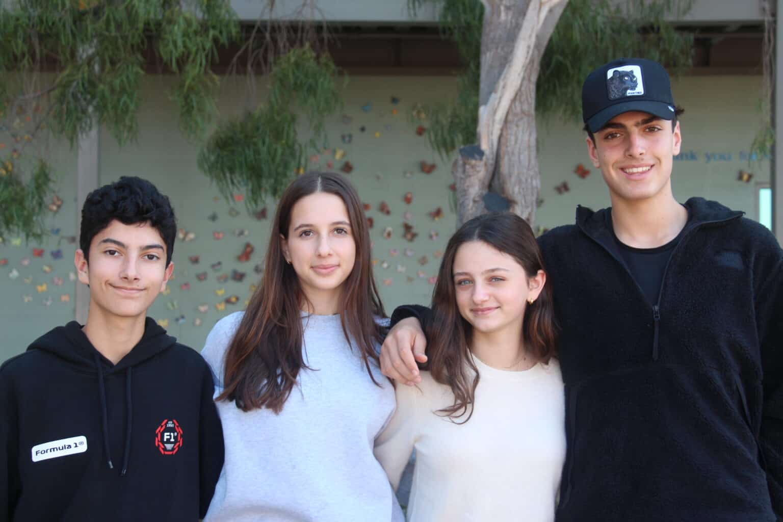 A group of MUS students pose together on campus