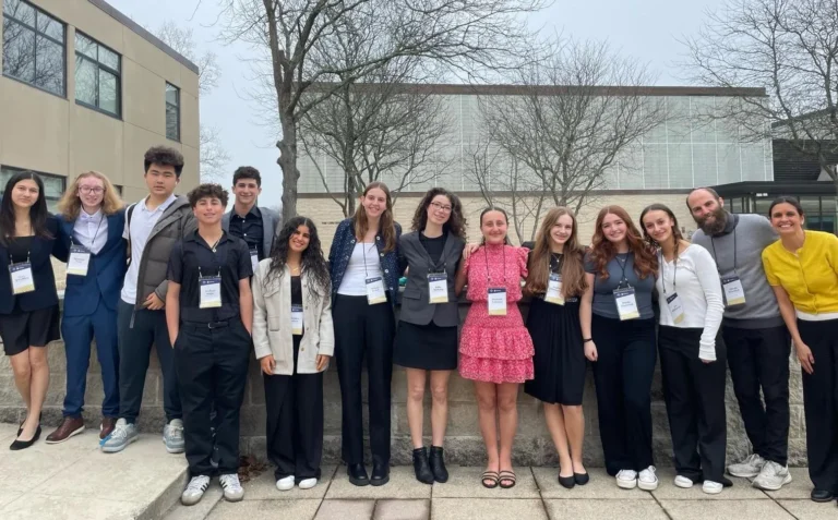 A group of SDJA high school students pose together at the Maimonides Moot Court Competition in New York