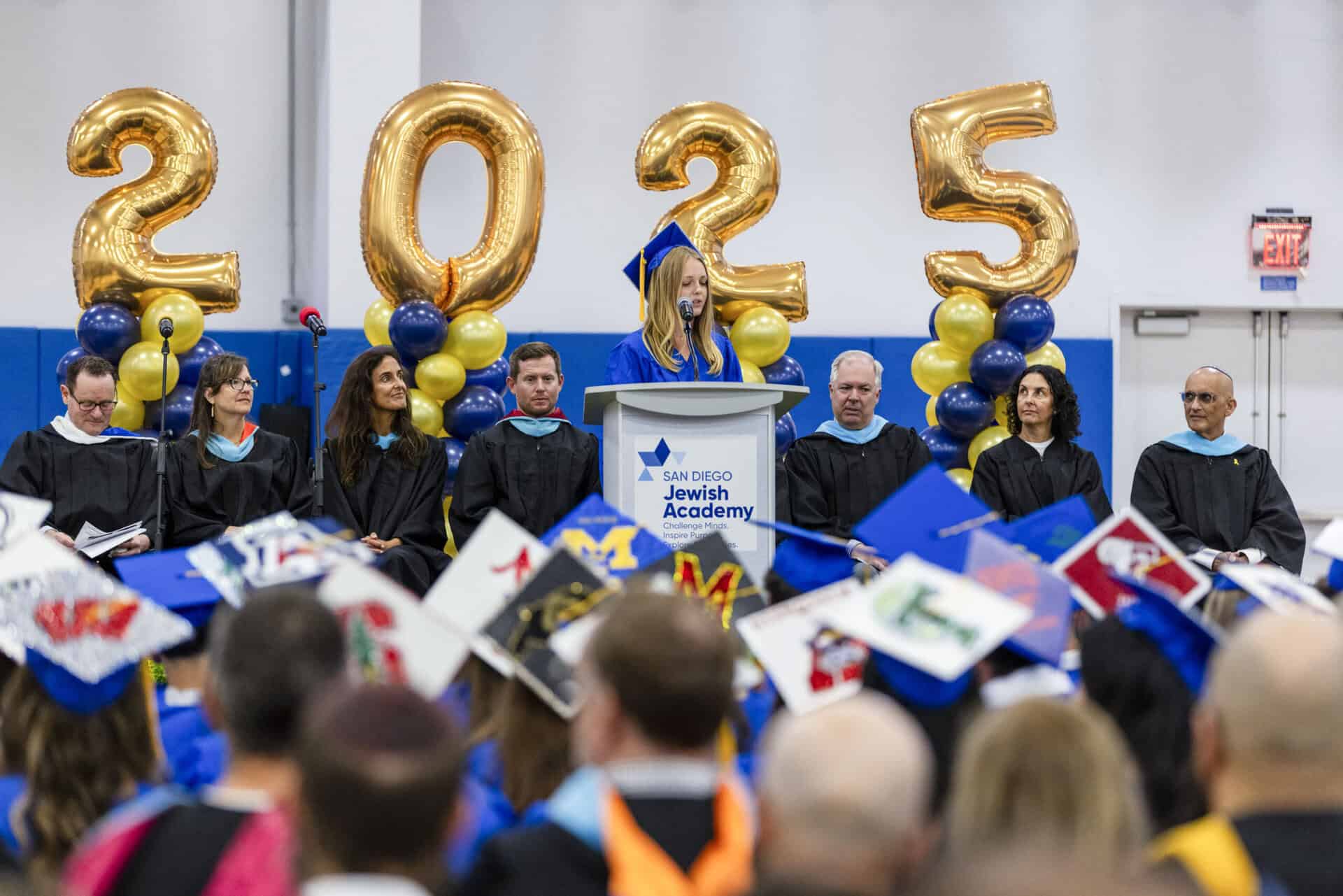 An SDJA student speaking during the 2025 graduation ceremony.
