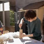 A boy making a ceramic piece of art