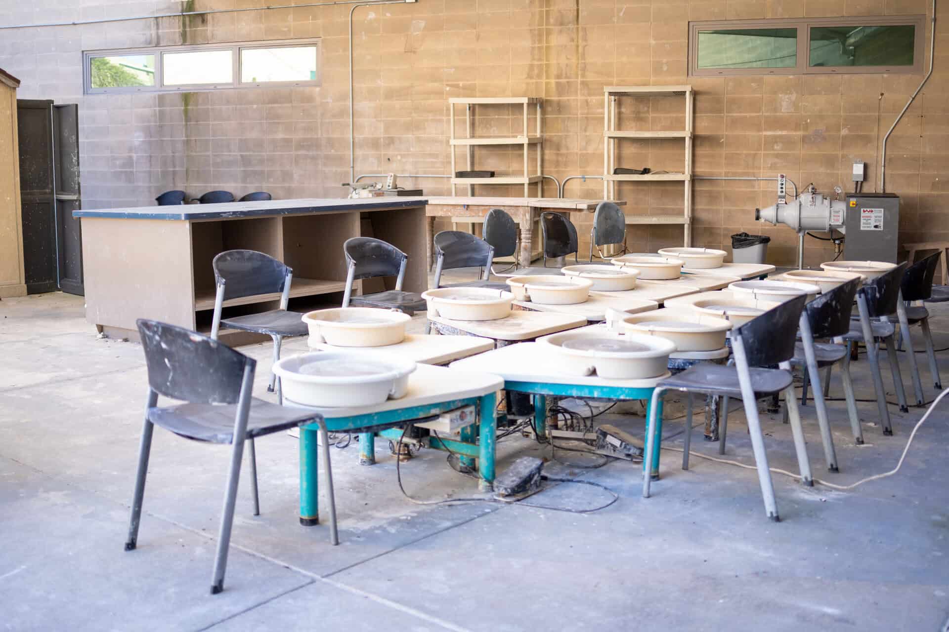 Chairs and bowls set up in the SDJA ceramics area.