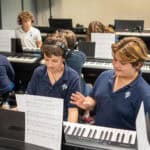 SDJA students practicing piano