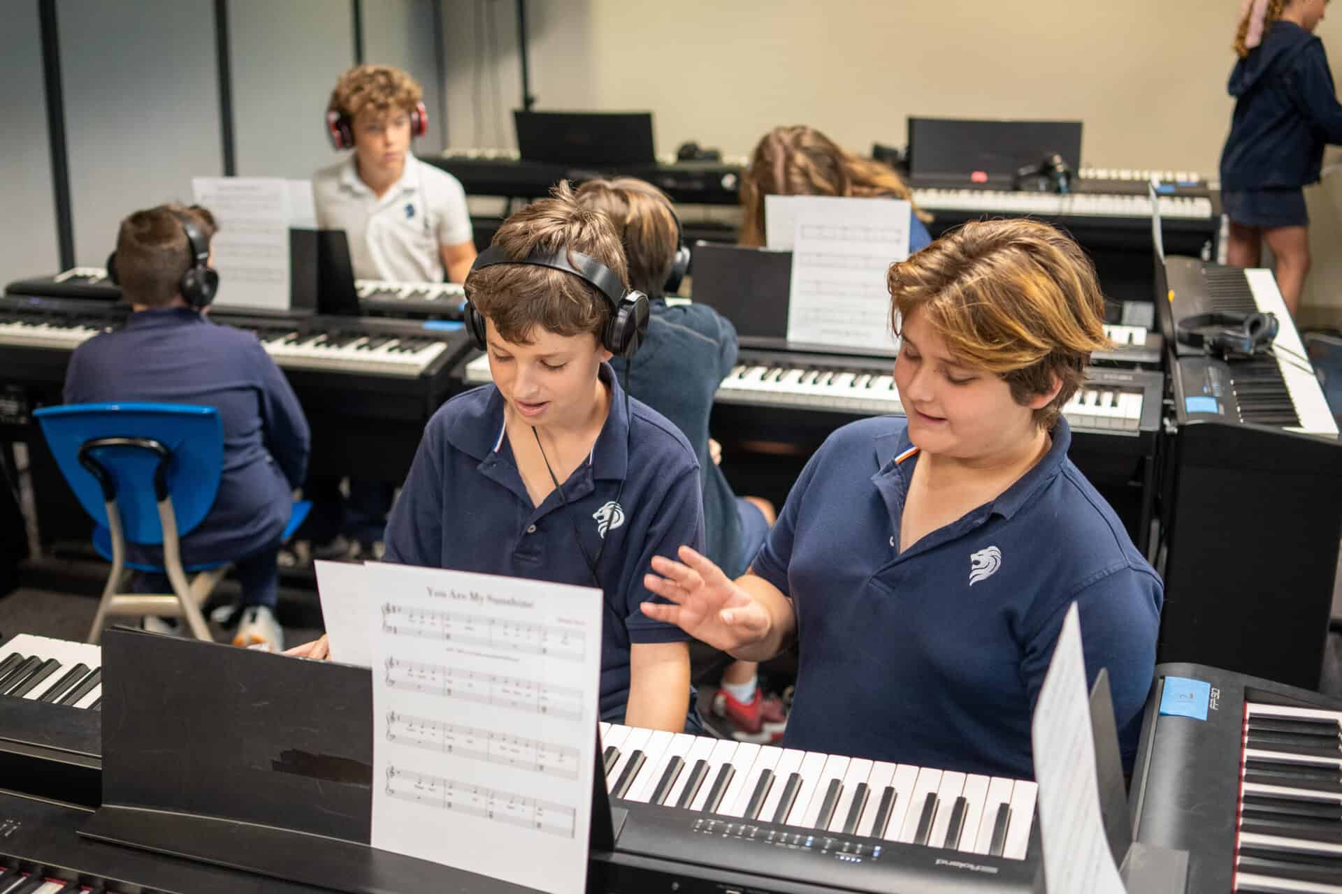 SDJA students practicing piano