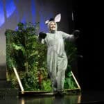 A person dressed in costume as a mouse during a school performance