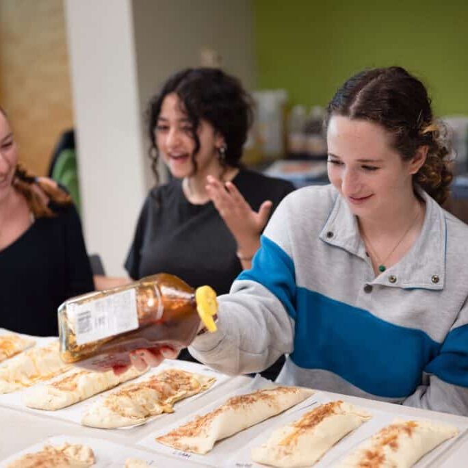 Upper School students baking a holiday treat
