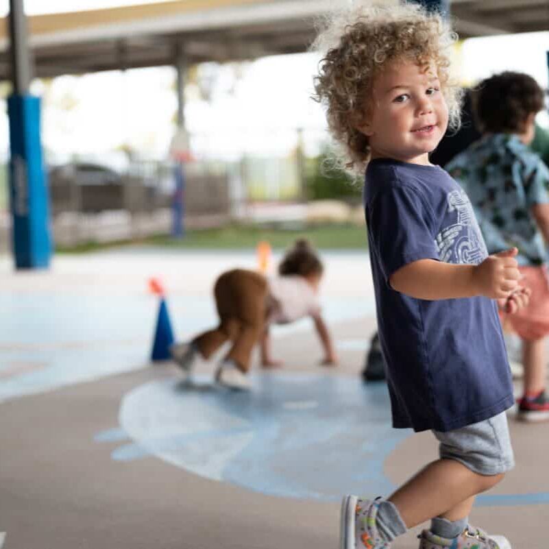 Child playing on the ECC playground