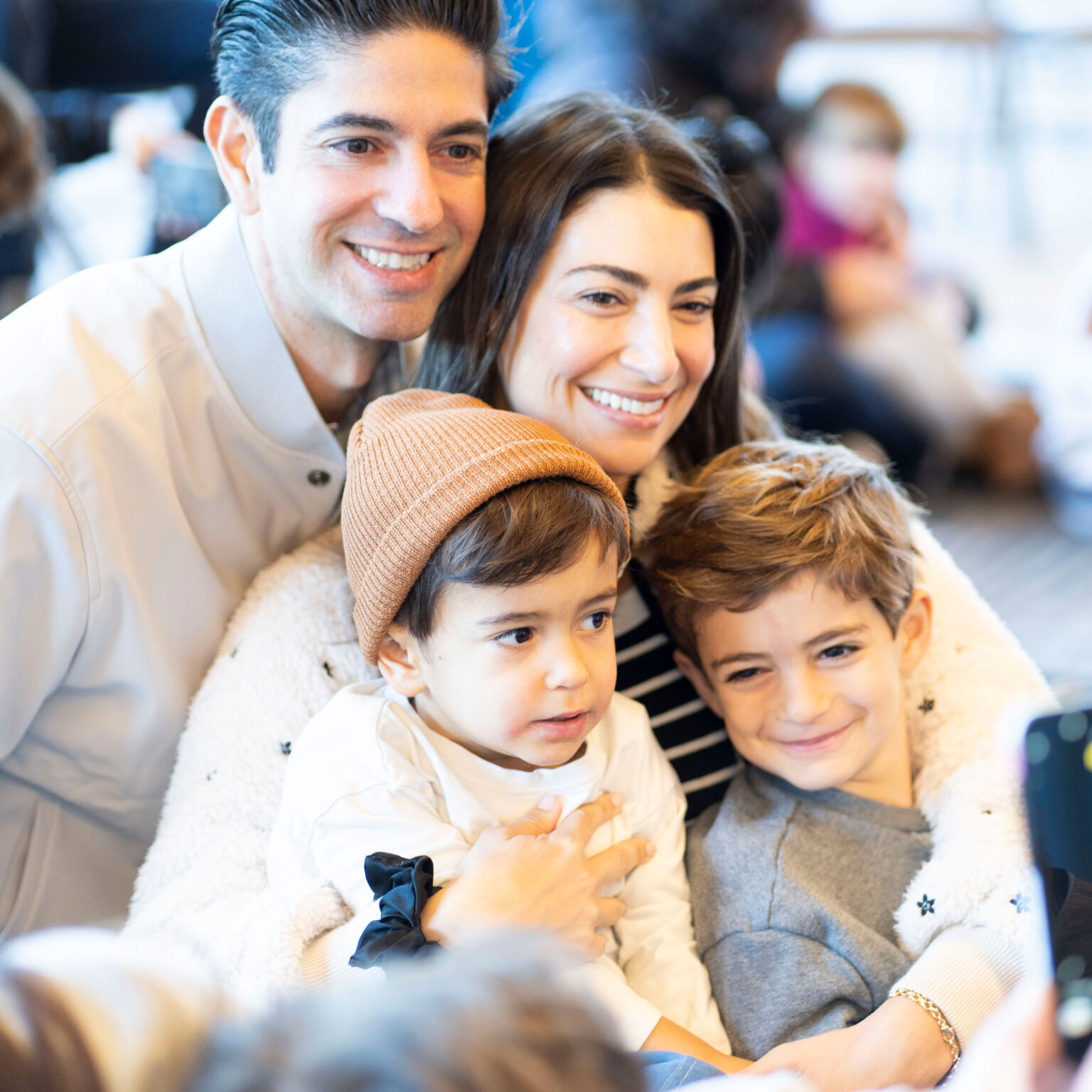 Preschool family participating in a sing-a-long on campus