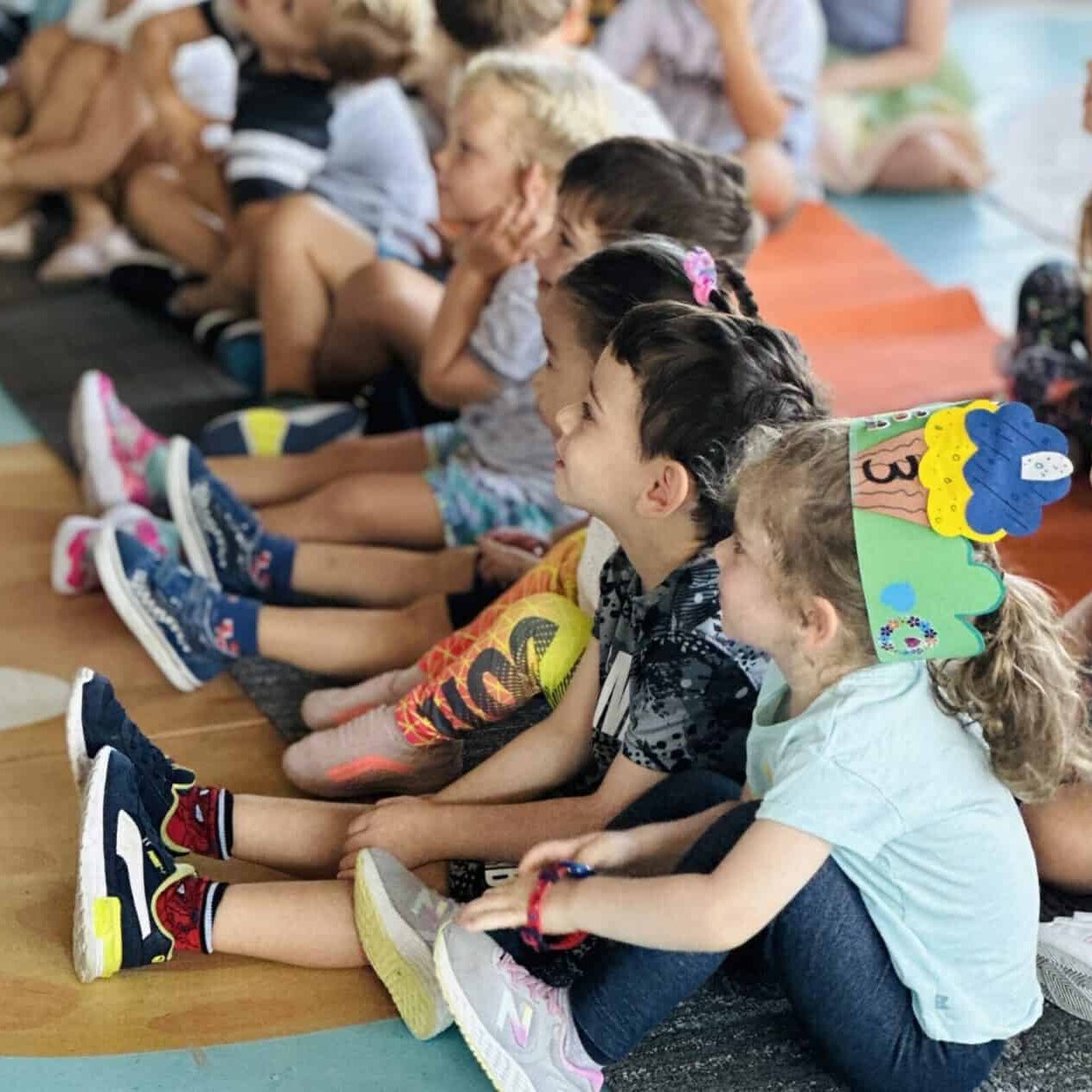 ECC students sit together on the foor