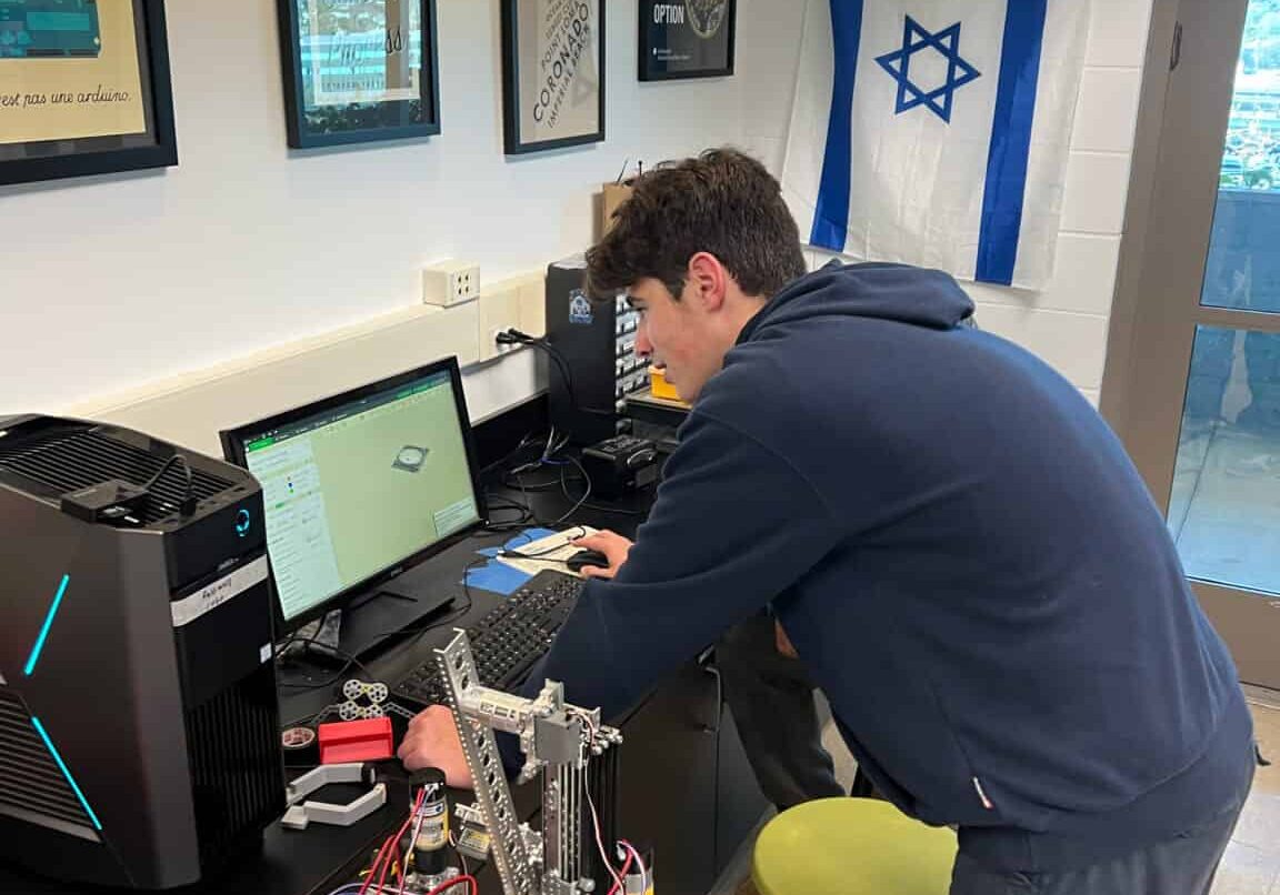 A student working at a computer in the Innovation Lab