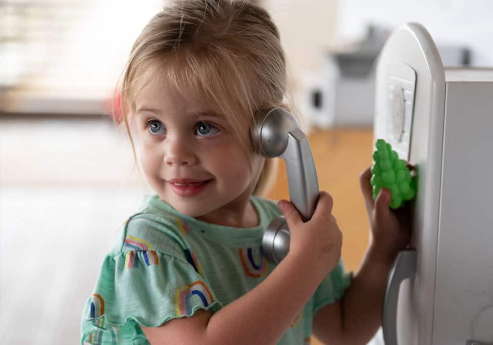 ECC student holding a play phone